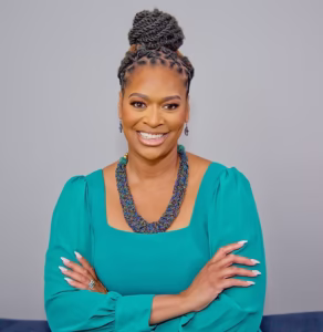 Brooke Smallwood green dress sitting picture of Brooke Smallwood